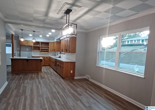 kitchen featuring dark wood-type flooring, stainless steel dishwasher, sink, and hanging light fixtures