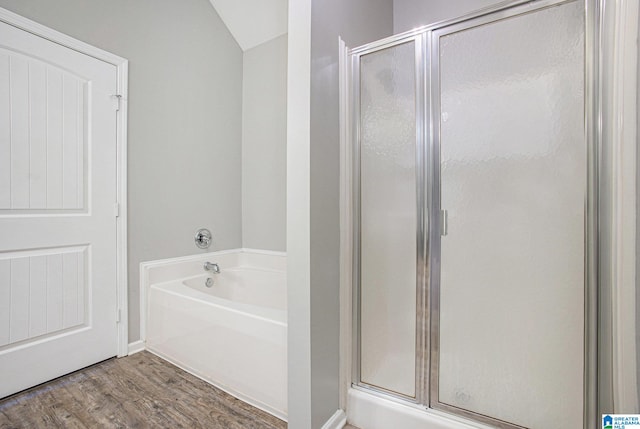 bathroom featuring independent shower and bath and wood-type flooring