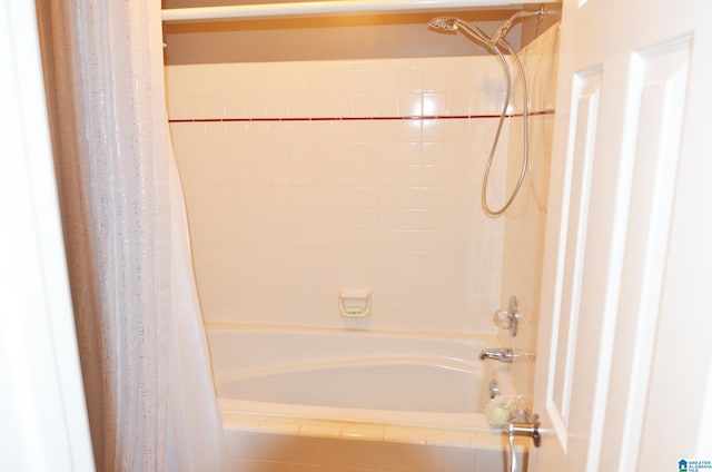 bathroom featuring shower / bathtub combination with curtain