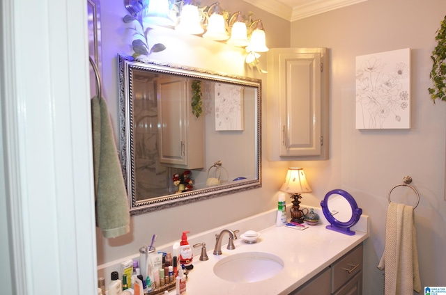 bathroom with ornamental molding and vanity