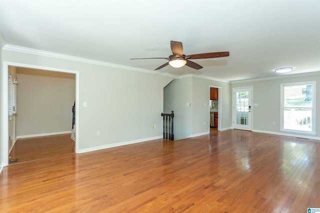 unfurnished living room with crown molding, ceiling fan, and light hardwood / wood-style floors