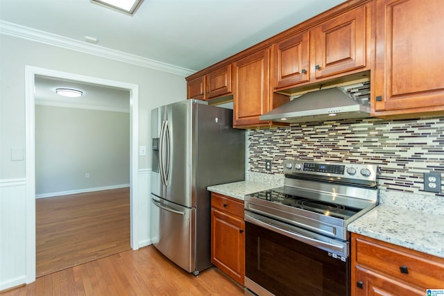 kitchen with ornamental molding, stainless steel appliances, light stone countertops, light hardwood / wood-style floors, and decorative backsplash