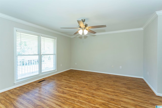 unfurnished room featuring ceiling fan, ornamental molding, and hardwood / wood-style floors