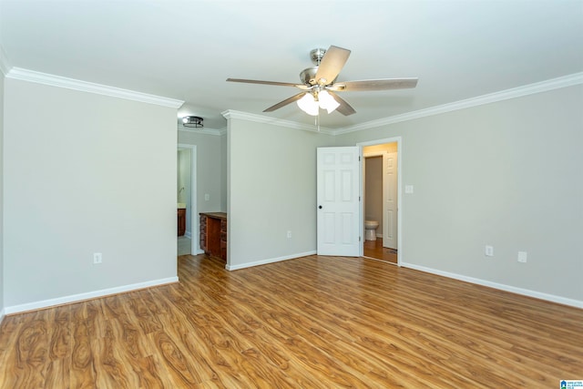 spare room with ceiling fan, light hardwood / wood-style flooring, and ornamental molding