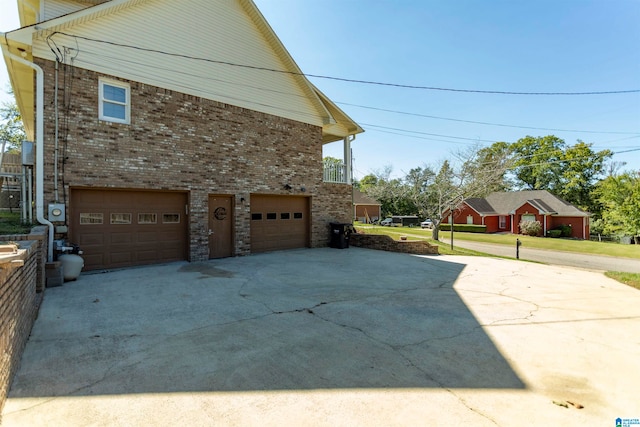 view of side of property featuring a garage