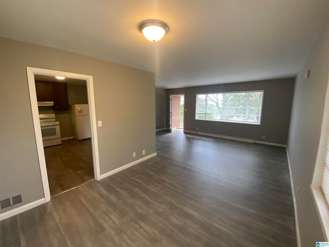 unfurnished room with dark wood-type flooring