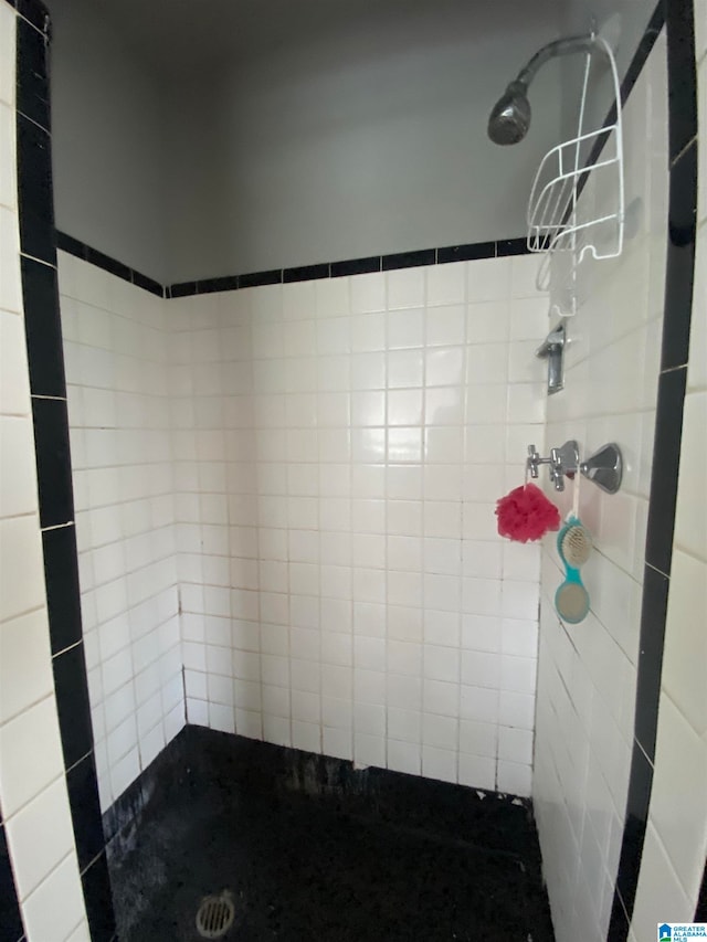 bathroom with tiled shower