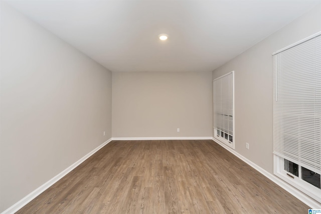 unfurnished room featuring hardwood / wood-style floors