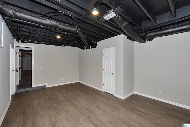 basement featuring hardwood / wood-style floors