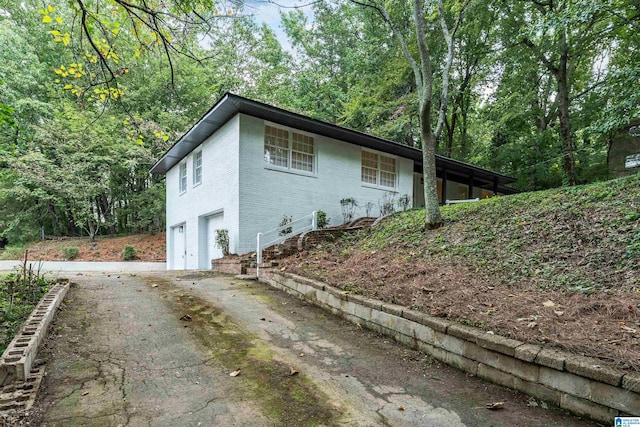 view of side of home with a garage