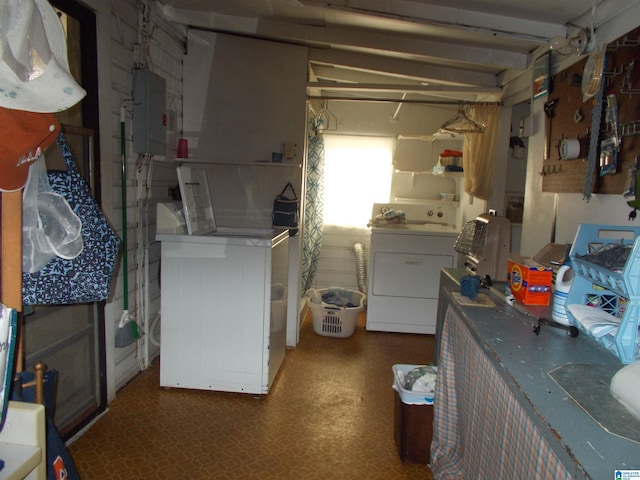 313 2nd St, Docena, AL 35060 - kitchen featuring washer and dryer, tile patterned floors, electric panel, and white cabinets