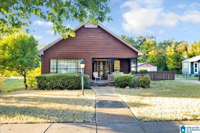 view of front facade with a porch and a front lawn