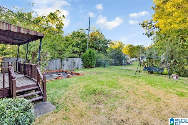 view of yard featuring a wooden deck