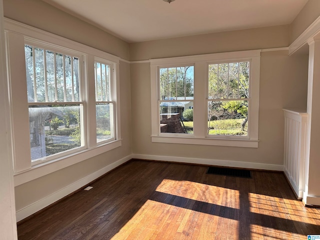 empty room featuring dark hardwood / wood-style floors