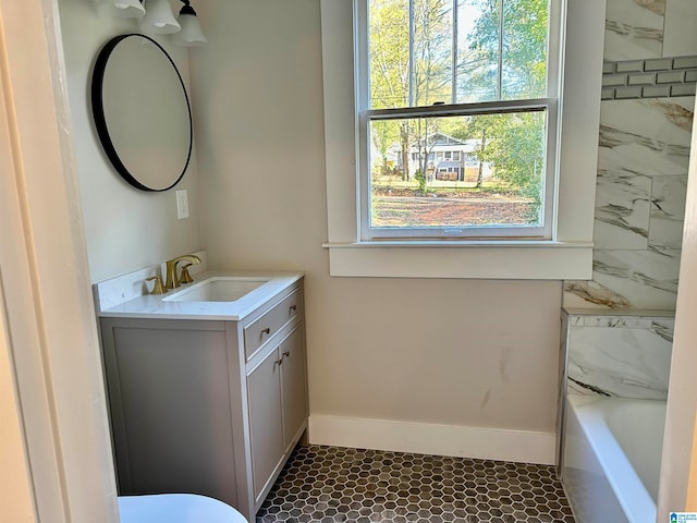 bathroom with tile patterned floors and vanity