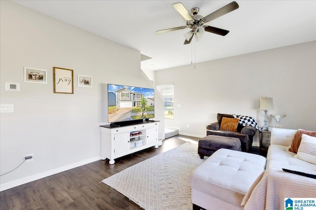 living room with dark hardwood / wood-style flooring and ceiling fan