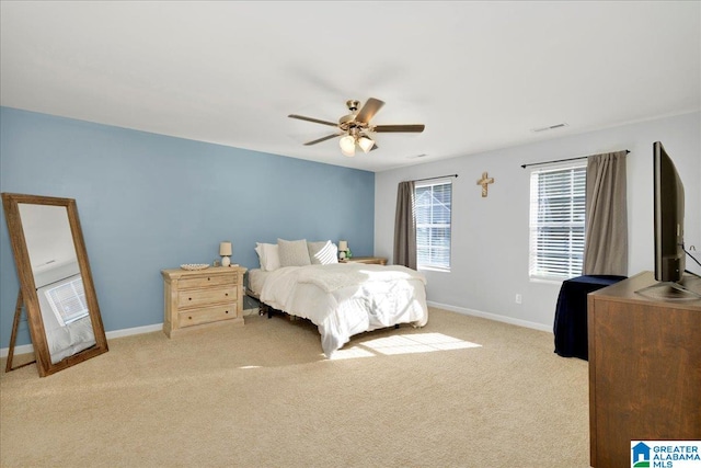 bedroom with light carpet and ceiling fan