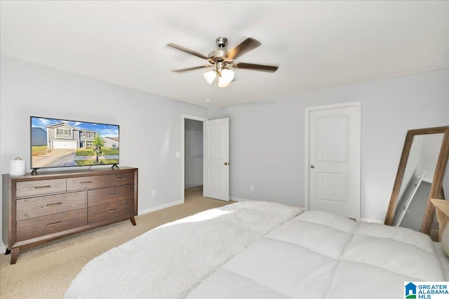 bedroom featuring light carpet and ceiling fan