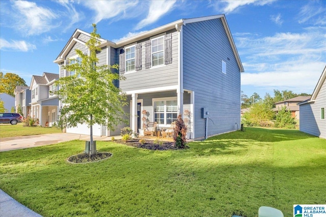 view of front of home with a garage and a front lawn