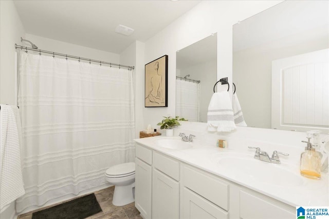 bathroom with toilet and vanity