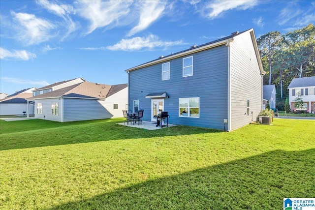 back of property featuring a lawn, cooling unit, and a patio