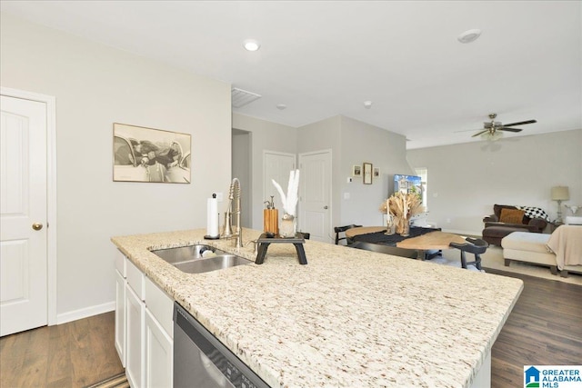 kitchen with sink, dark hardwood / wood-style floors, stainless steel dishwasher, a kitchen island with sink, and white cabinets