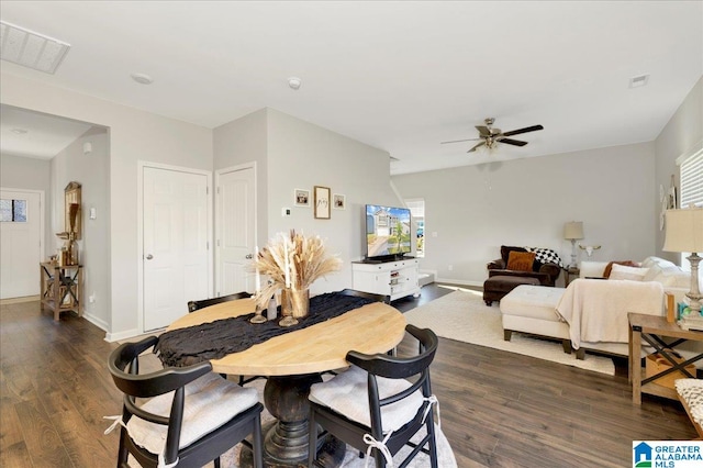 dining space with dark wood-type flooring, ceiling fan, and plenty of natural light