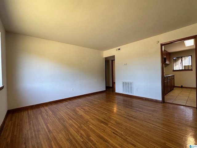 spare room featuring light hardwood / wood-style floors