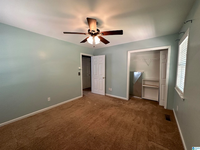 unfurnished bedroom with a closet, ceiling fan, and carpet floors