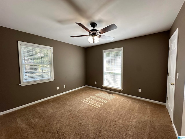 empty room with carpet floors and ceiling fan