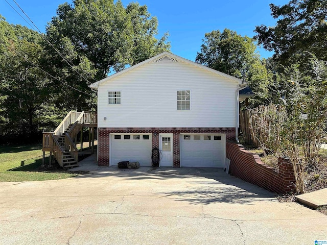 view of side of property with a garage