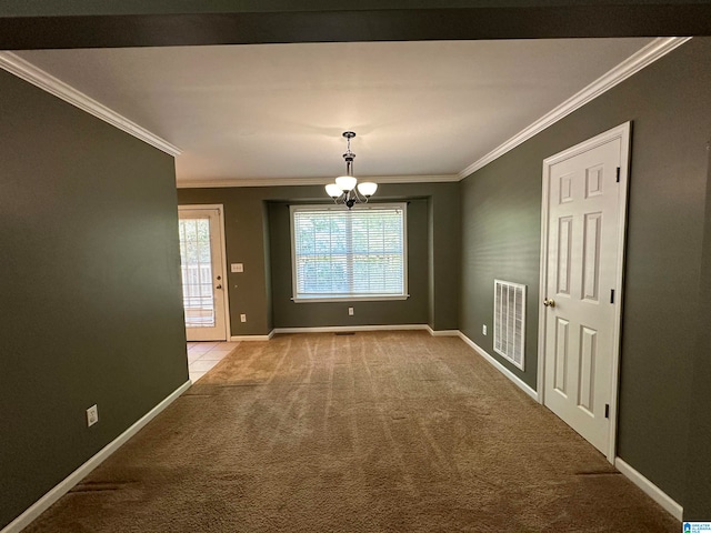 unfurnished dining area with light carpet, ornamental molding, and an inviting chandelier