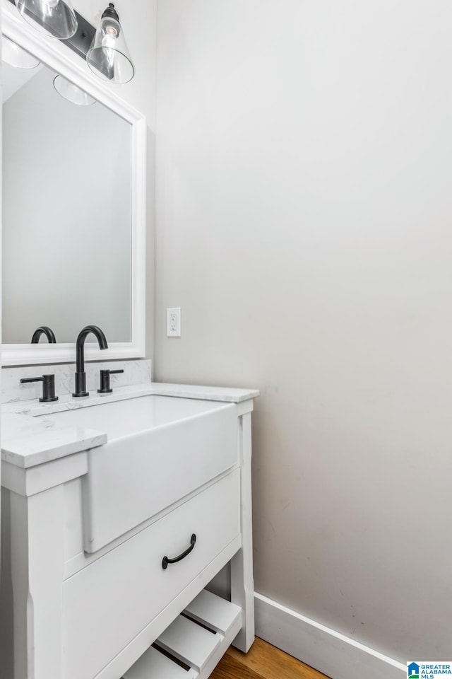 bathroom with vanity and hardwood / wood-style floors