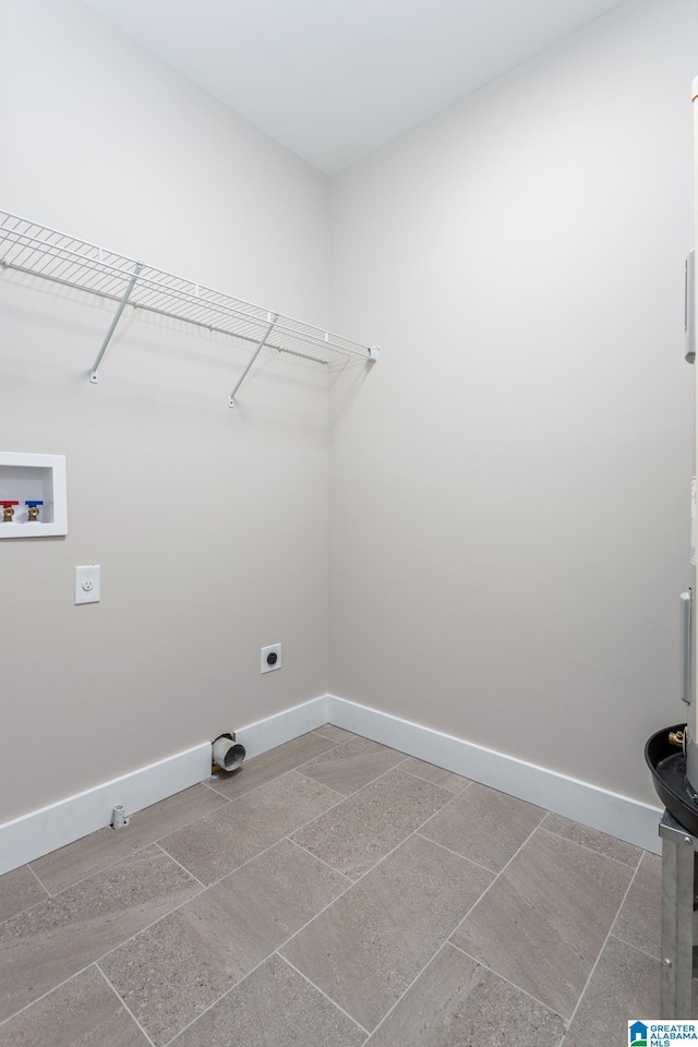 clothes washing area featuring hookup for a washing machine and electric dryer hookup