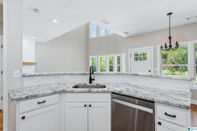 kitchen with sink, a healthy amount of sunlight, white cabinets, and dishwasher