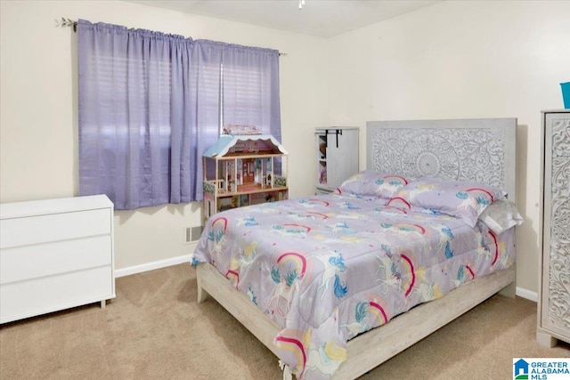 bedroom with light colored carpet