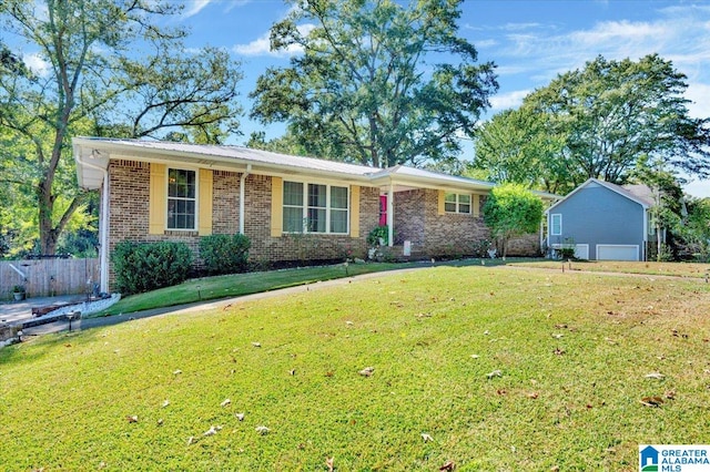 ranch-style home with a front lawn