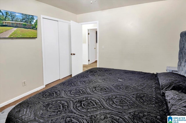 carpeted bedroom with a closet