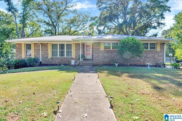 ranch-style home with a front yard