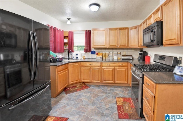 kitchen featuring a textured ceiling, sink, decorative backsplash, and black appliances