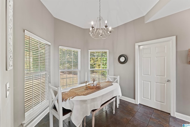 dining space featuring a notable chandelier