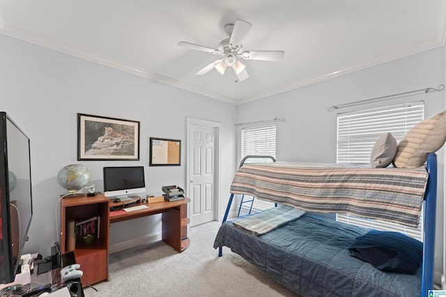 bedroom featuring ornamental molding, light colored carpet, and ceiling fan