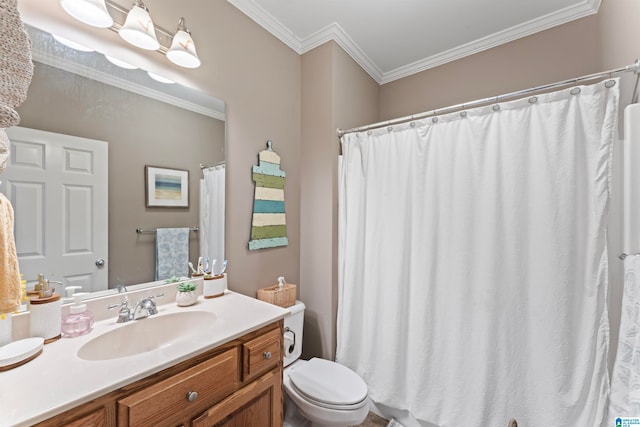 bathroom with vanity, ornamental molding, and toilet