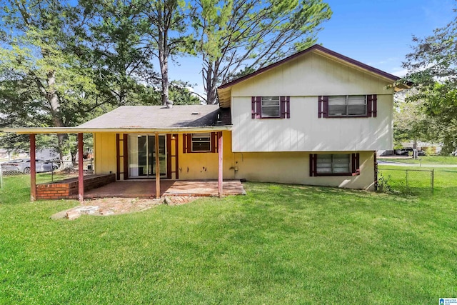 back of property featuring a yard and a patio area