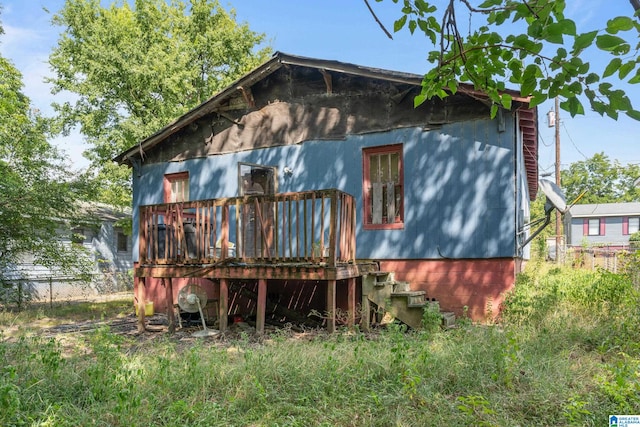 back of house featuring a deck