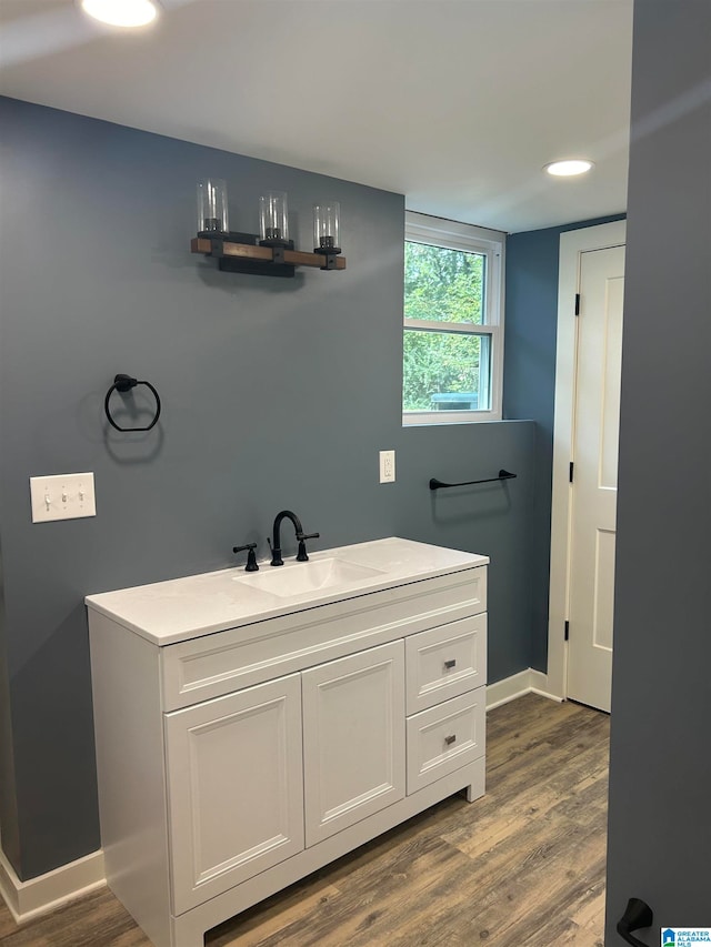 bathroom featuring vanity and hardwood / wood-style floors