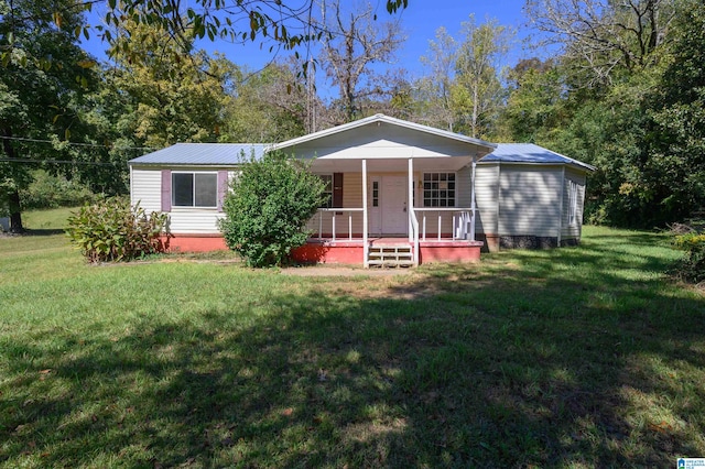 view of front of house with a front yard and covered porch