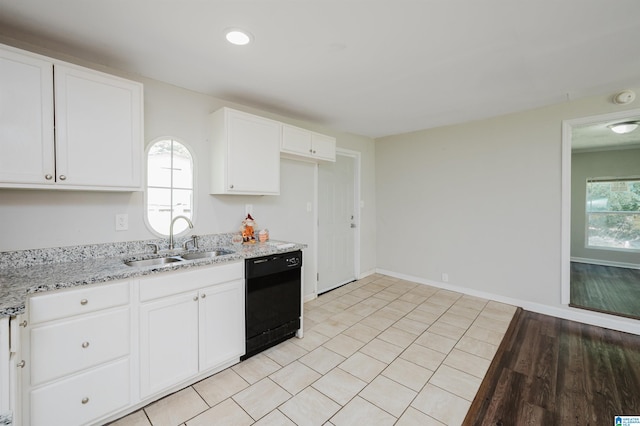 kitchen with dishwasher, light hardwood / wood-style floors, sink, and a wealth of natural light