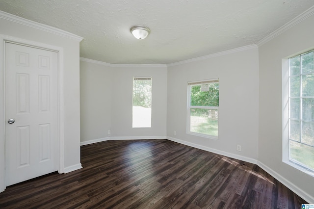 unfurnished room with ornamental molding, a wealth of natural light, and dark hardwood / wood-style floors