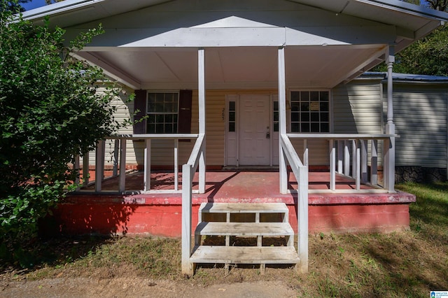 entrance to property featuring a porch